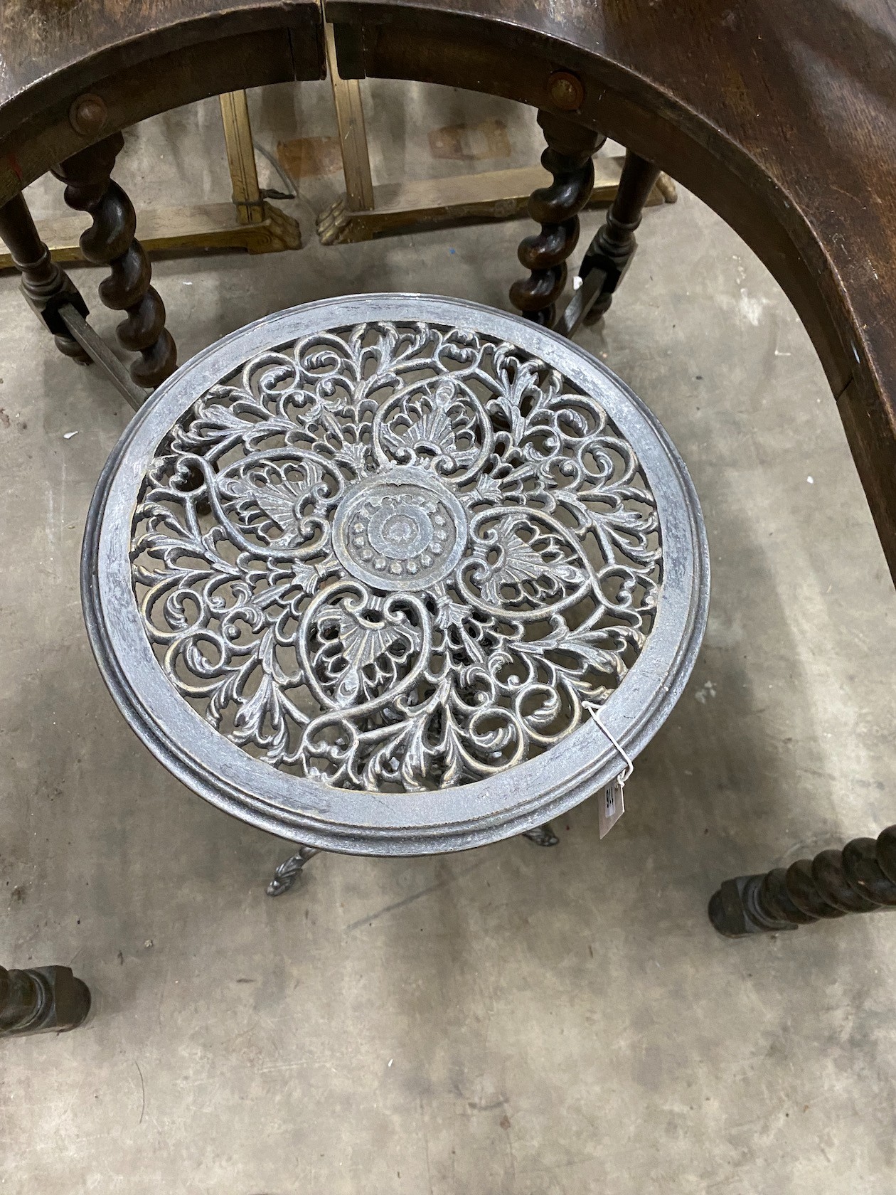 A Victorian style cast iron circular table, diameter 36cm, height 72cm